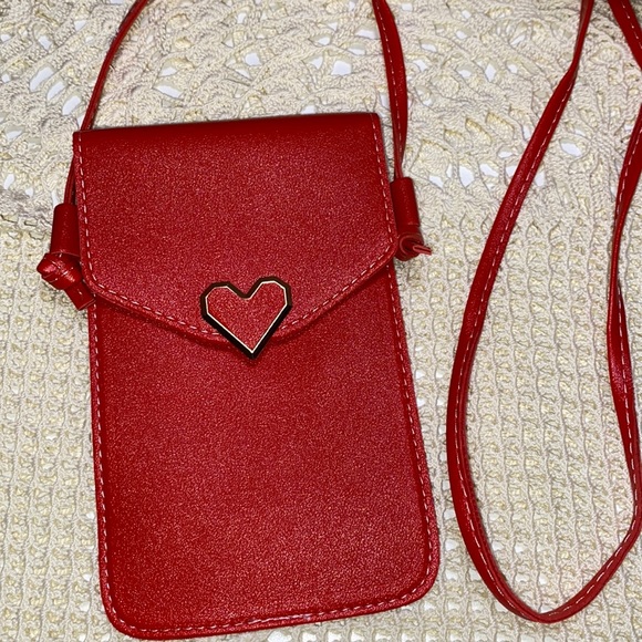 Handbags - 3/$15 Red faux leather crossbody with heart snap and clear back